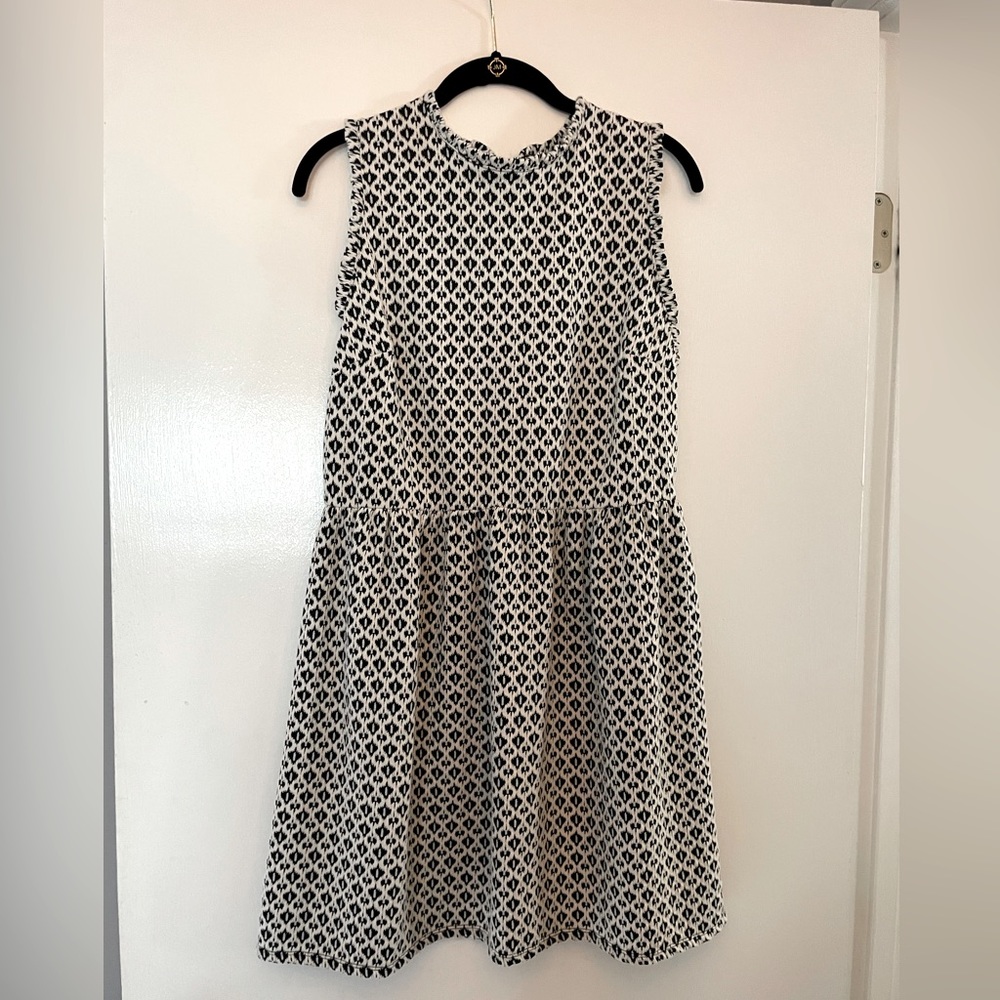 Xhilaration white with black print.  Zips in back, above knee length, size L